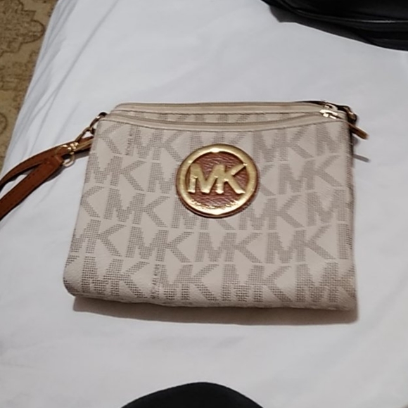 Michael Kors Handbags - RESERVED MK crossbody cream in color